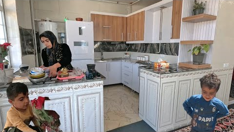 At the end of the year, Tayebeh, who is a single mother, installs the cabinet at home